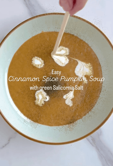 Healthy Cinnamon spice pumpkin soup with green salt